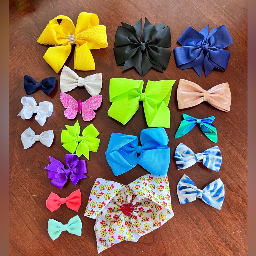 Quantity 19 assorted hair clip bows. Various colors and sizes.